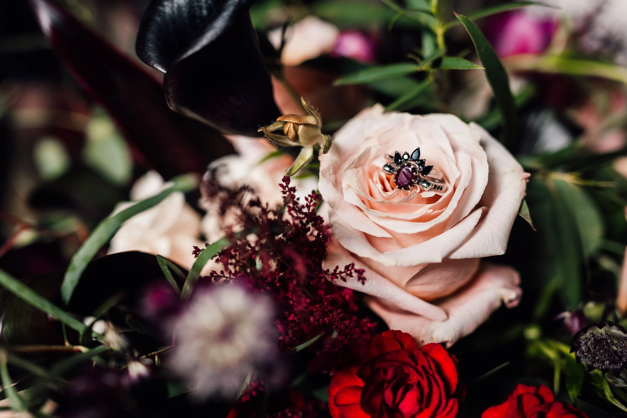Alternative wedding ring detail in flowers at Church Temple of Fun Sheffield wedding venue