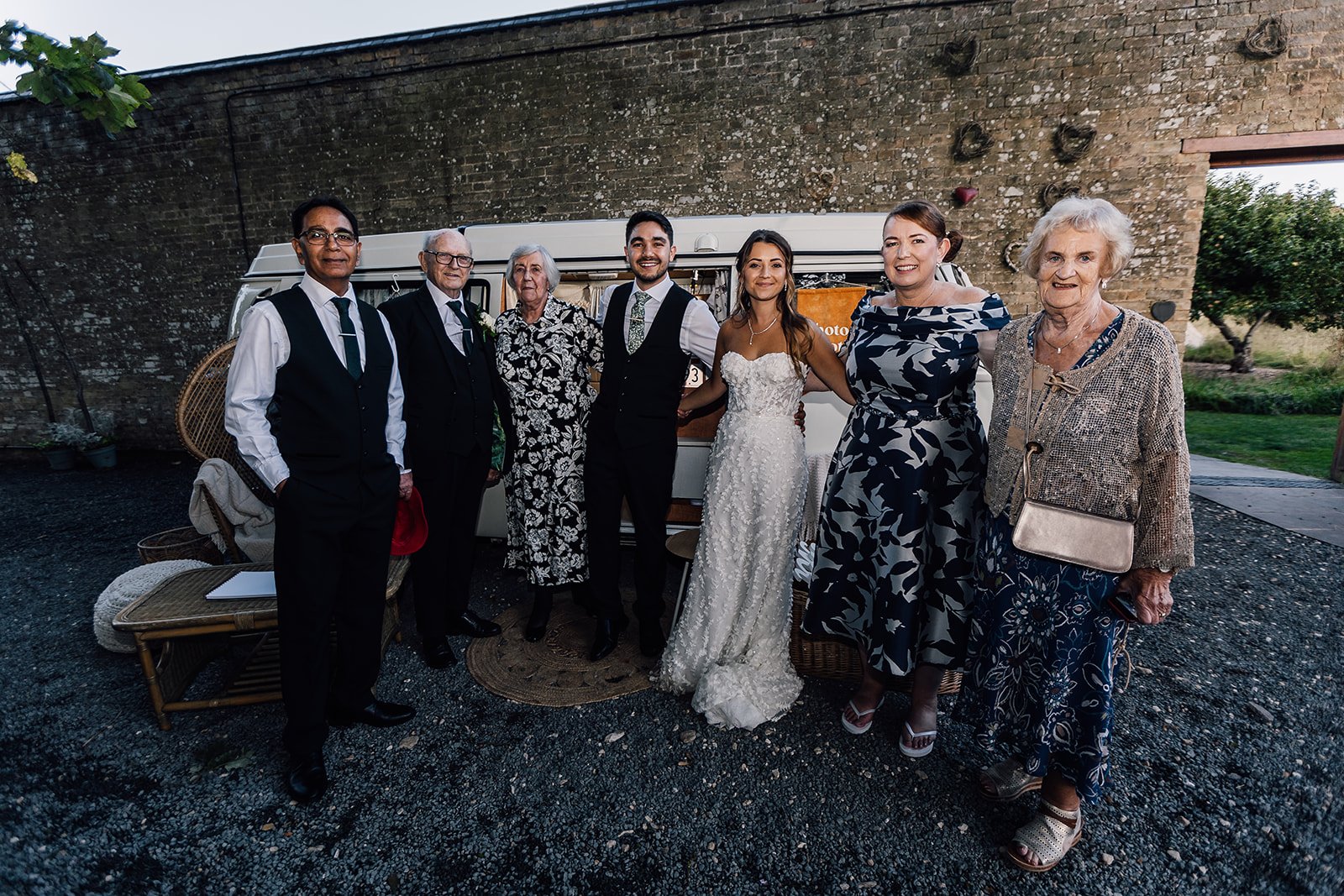 Charlotte and Rory with family beside the garden wall