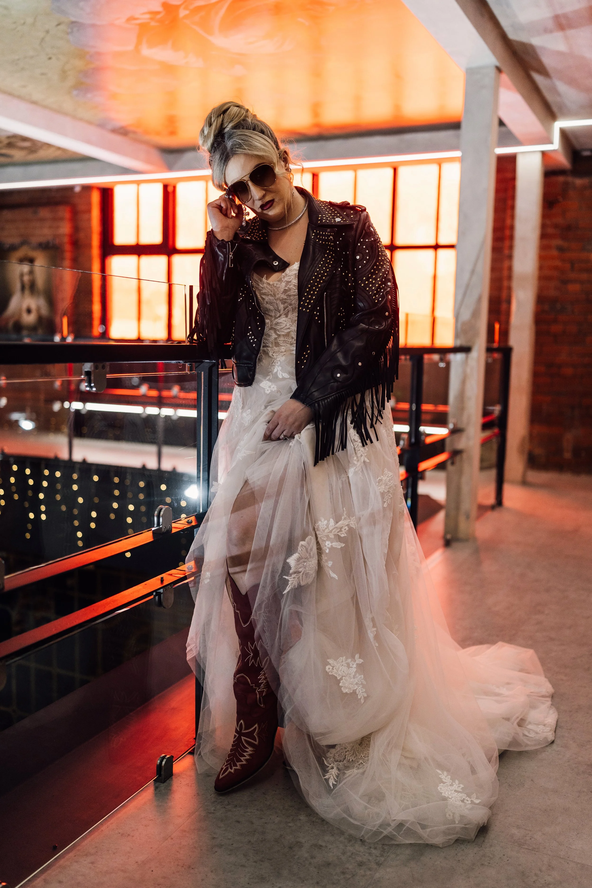 Alternative bride portrait with leather jacket and boots at Church Temple of Fun Sheffield wedding