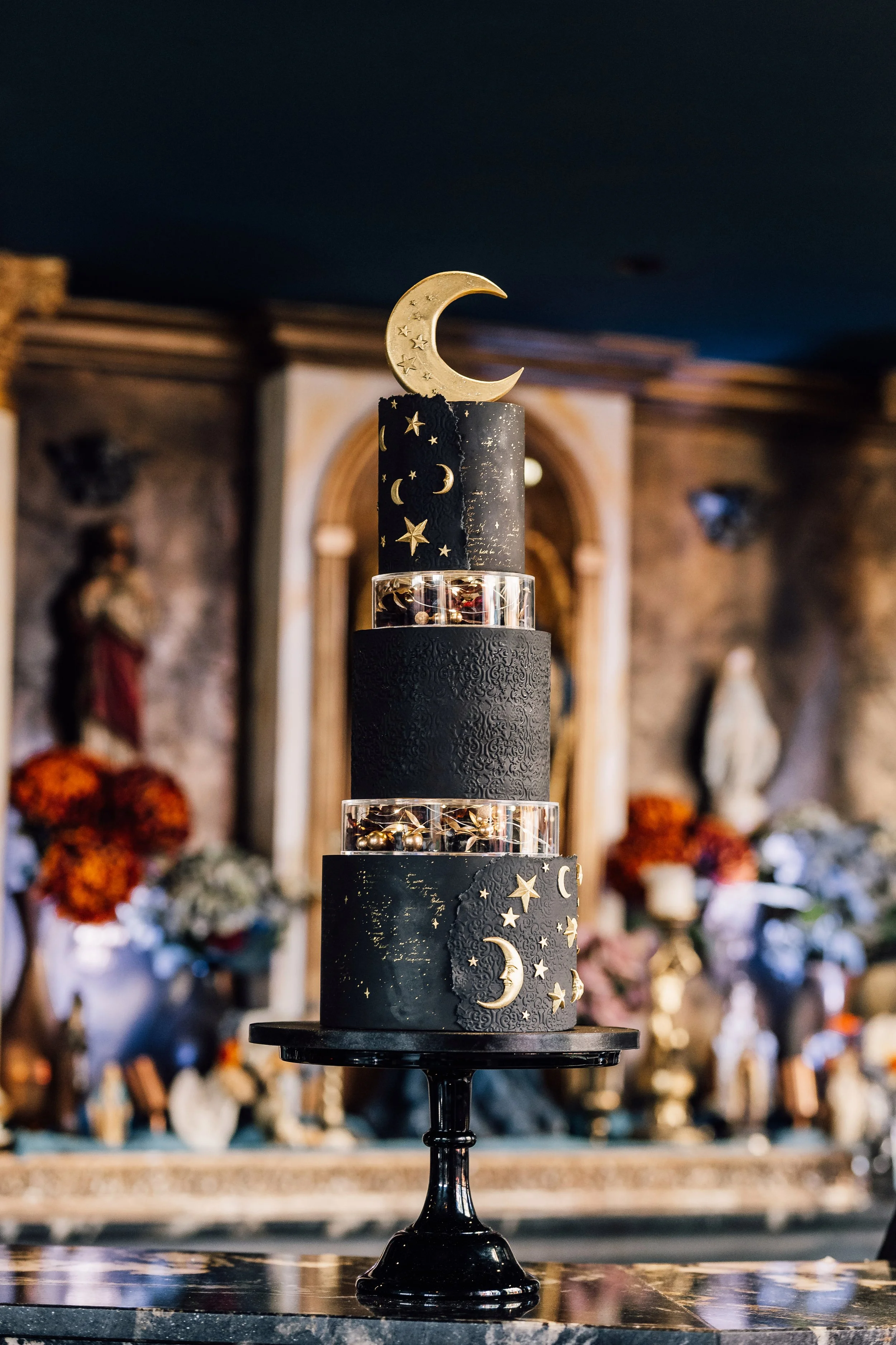 Celestial themed wedding cake with moon and stars at alternative Sheffield wedding venue