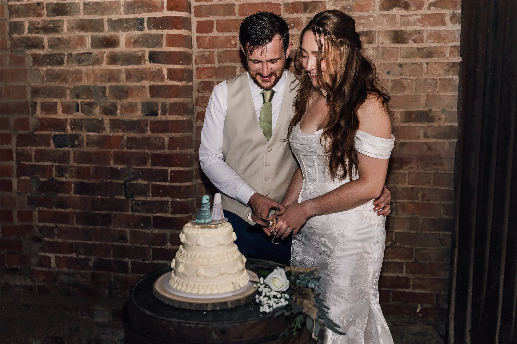 Bride and groom cutting cake at White Syke Fields
