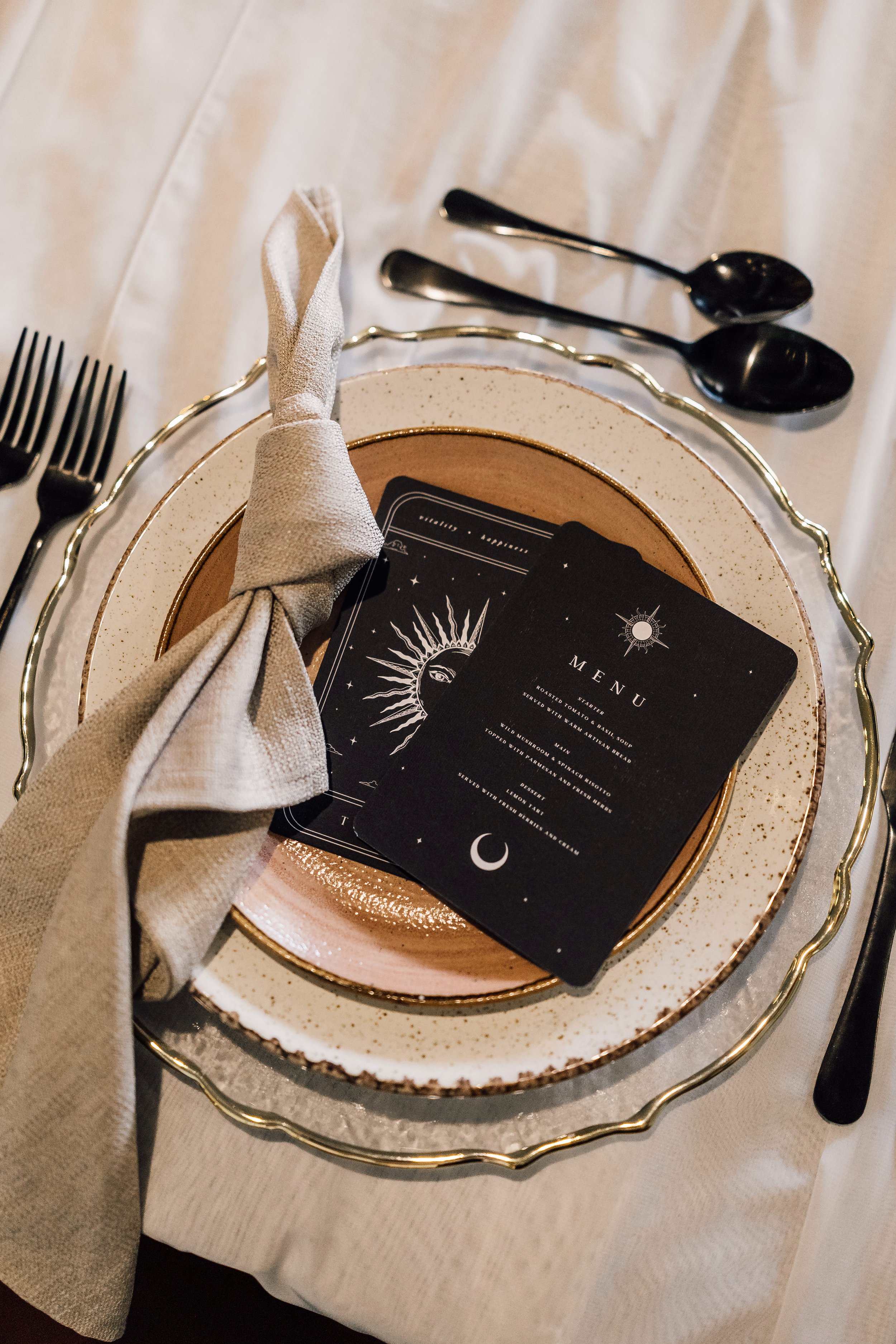 Alternative wedding place setting with black menu cards at Church Temple of Fun wedding Sheffield