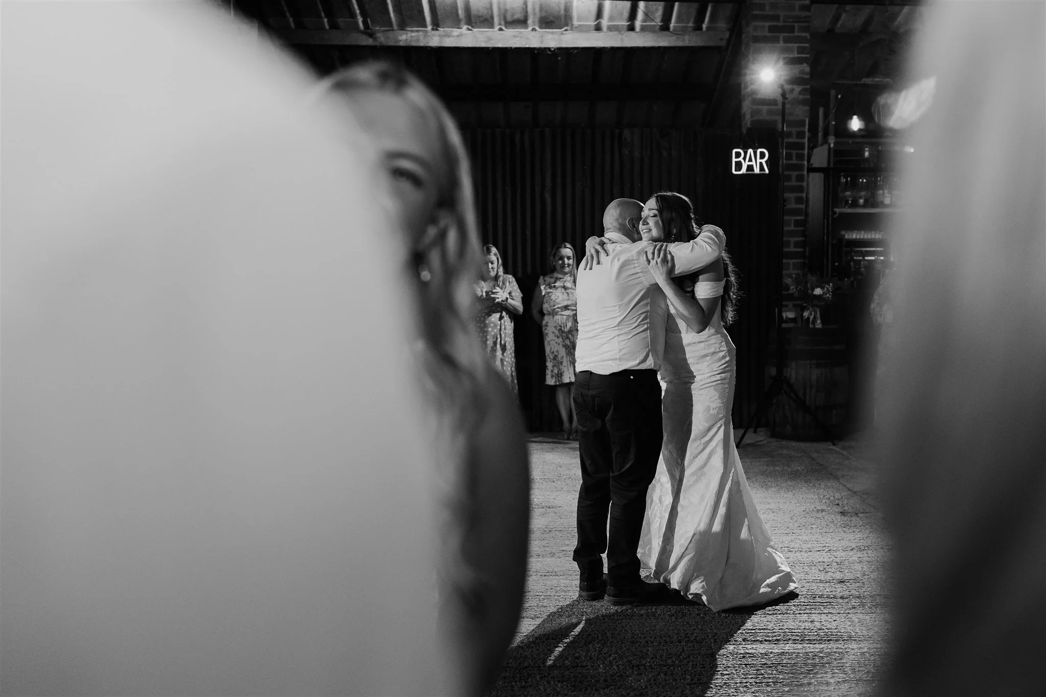 Bride hugging father on dance floor at White Syke Fields