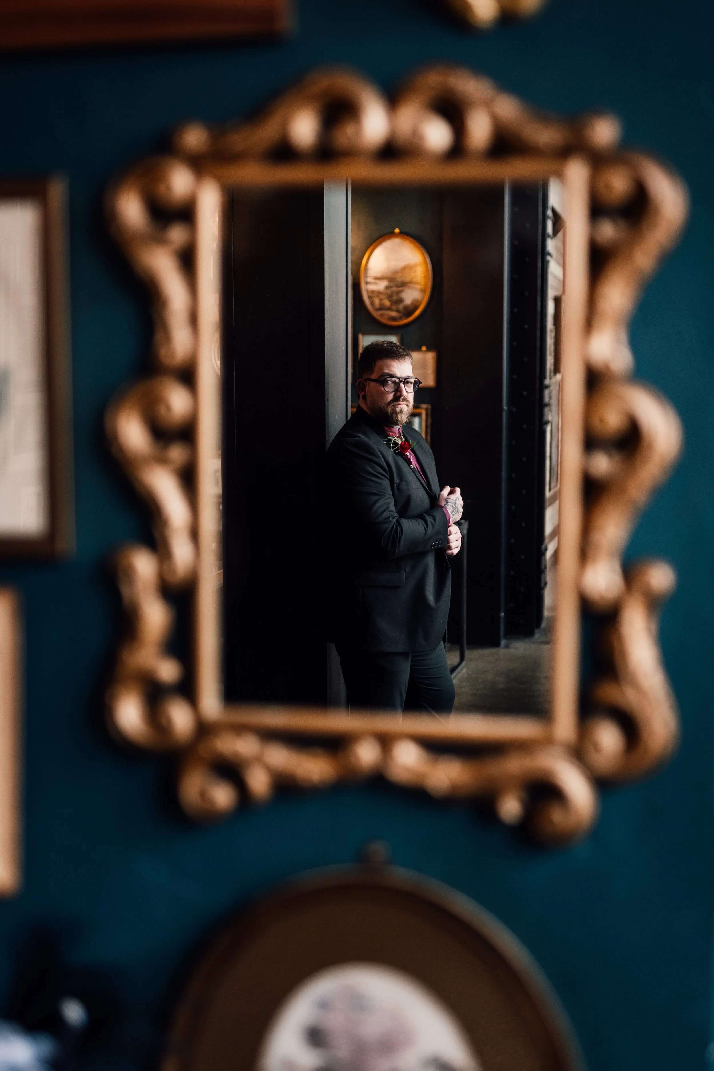 Groom portrait reflected in vintage mirror at Church Temple of Fun wedding Sheffield