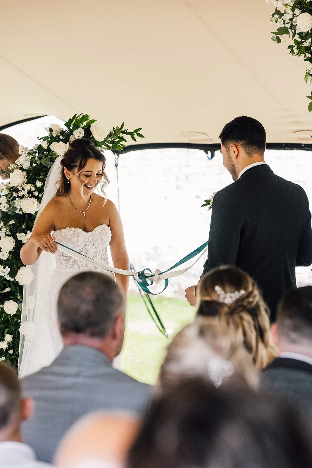 Charlotte and Rory facing each other during their wedding ceremony
