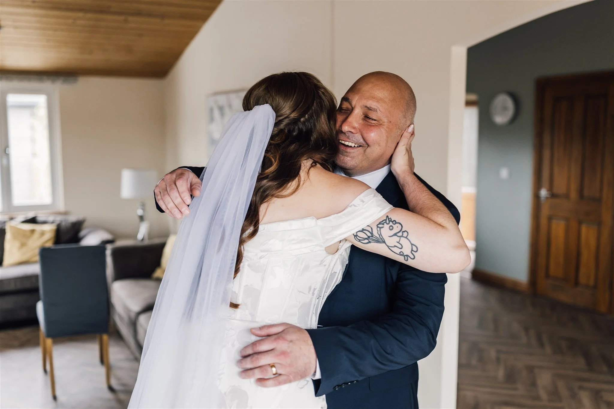 Father hugging bride after the first look