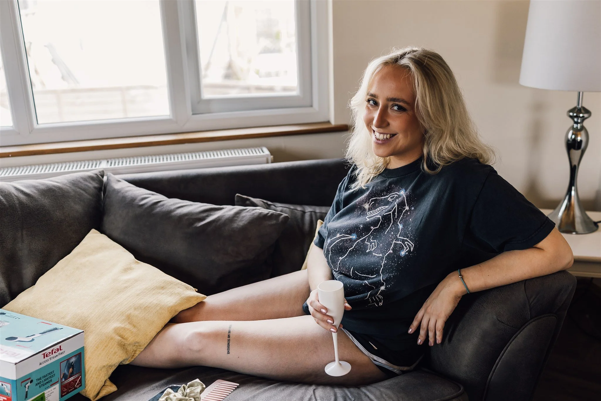 bridesmaid with prosecco at bridal prep