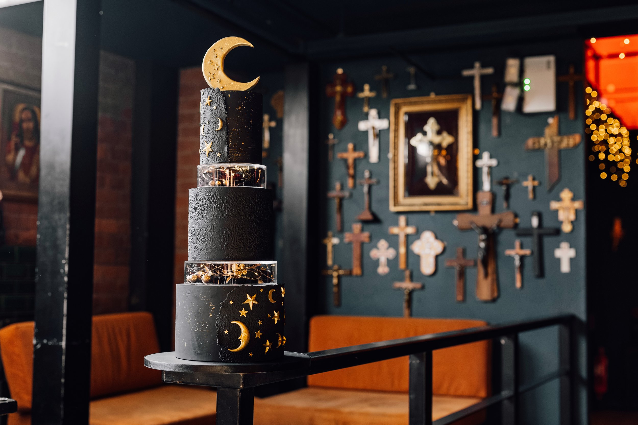 Alternative wedding cake with moon and star design at Church Temple of Fun Sheffield wedding venue