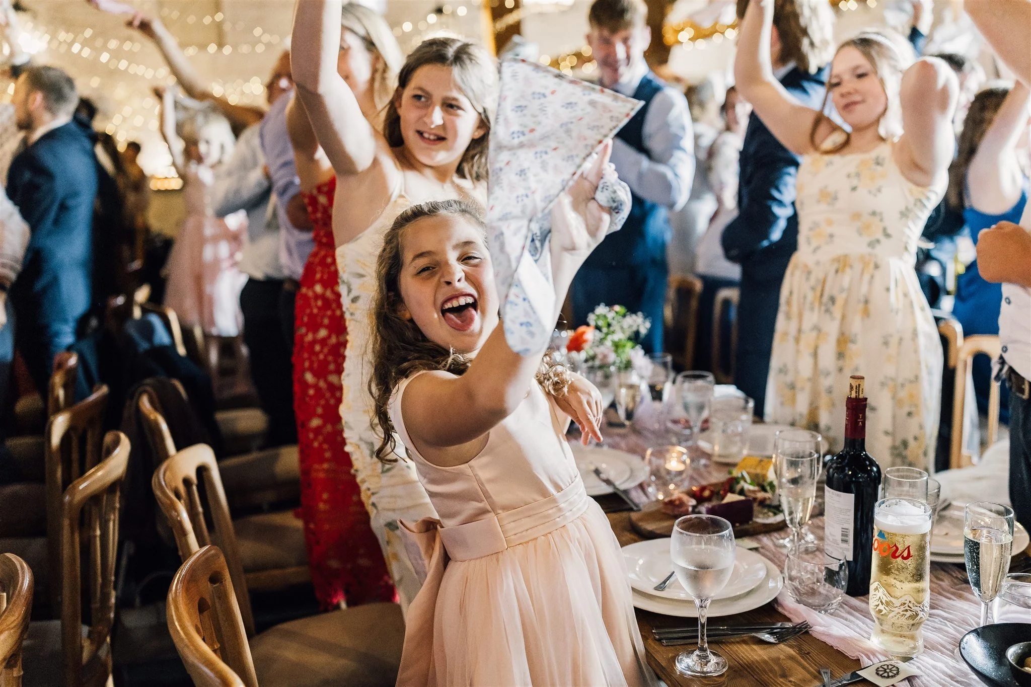 Wedding guests celebrating and dancing during reception at East Riddlesden Hall in West Yorkshire