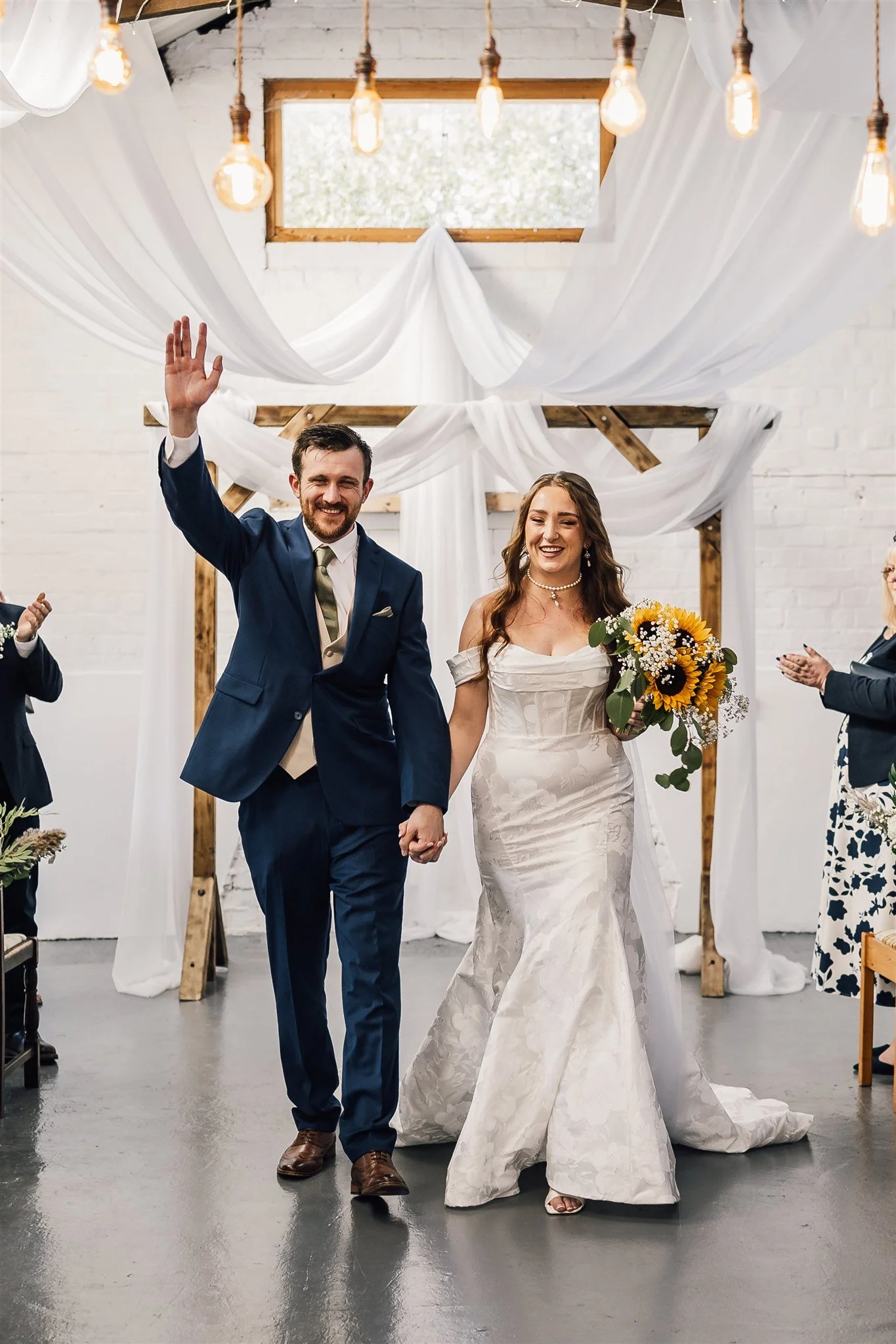 Bride and Groom Celebrating down Isle The Piggery White Syke Fields