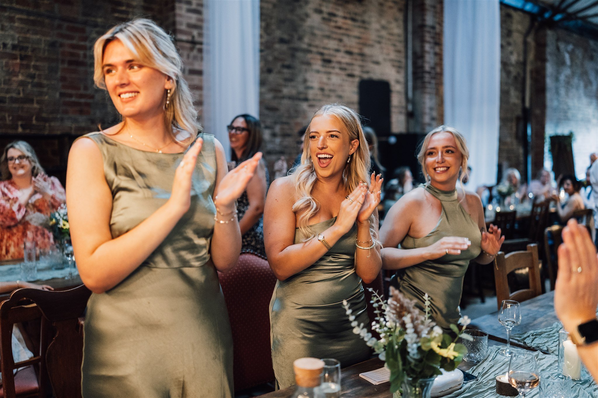 Bridesmaid clapping during speeches White Syke Fields