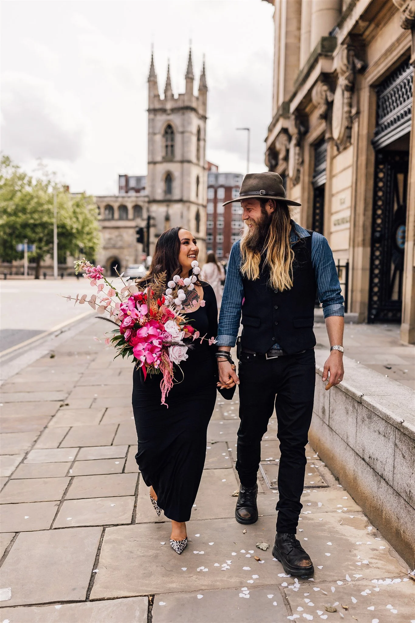 Ellie and Dave walking together after their Hull Guildhall wedding ceremony