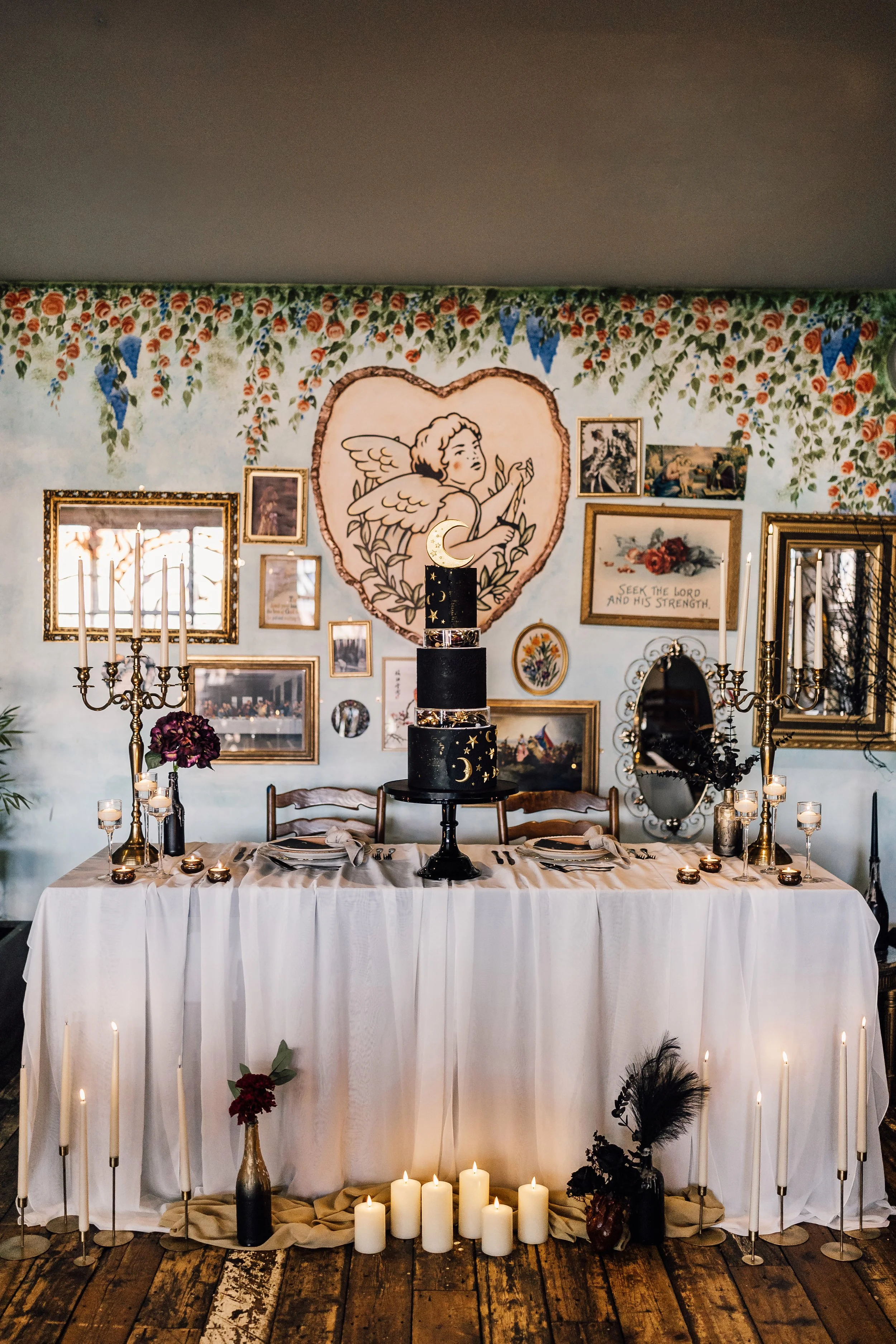 Alternative wedding cake table with candles and decor at Church Temple of Fun Sheffield venue