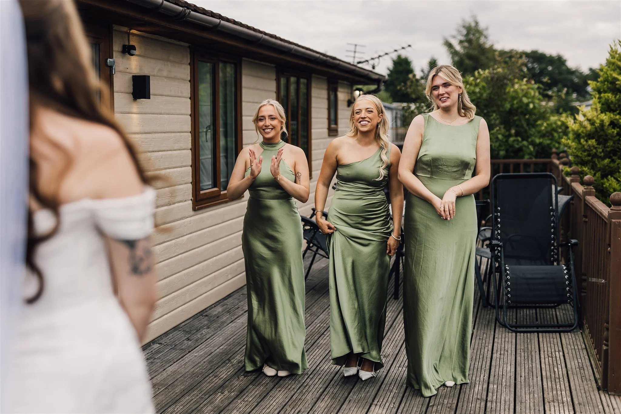 Bridesmaids reaction to seeing the bride in her dress for the first time