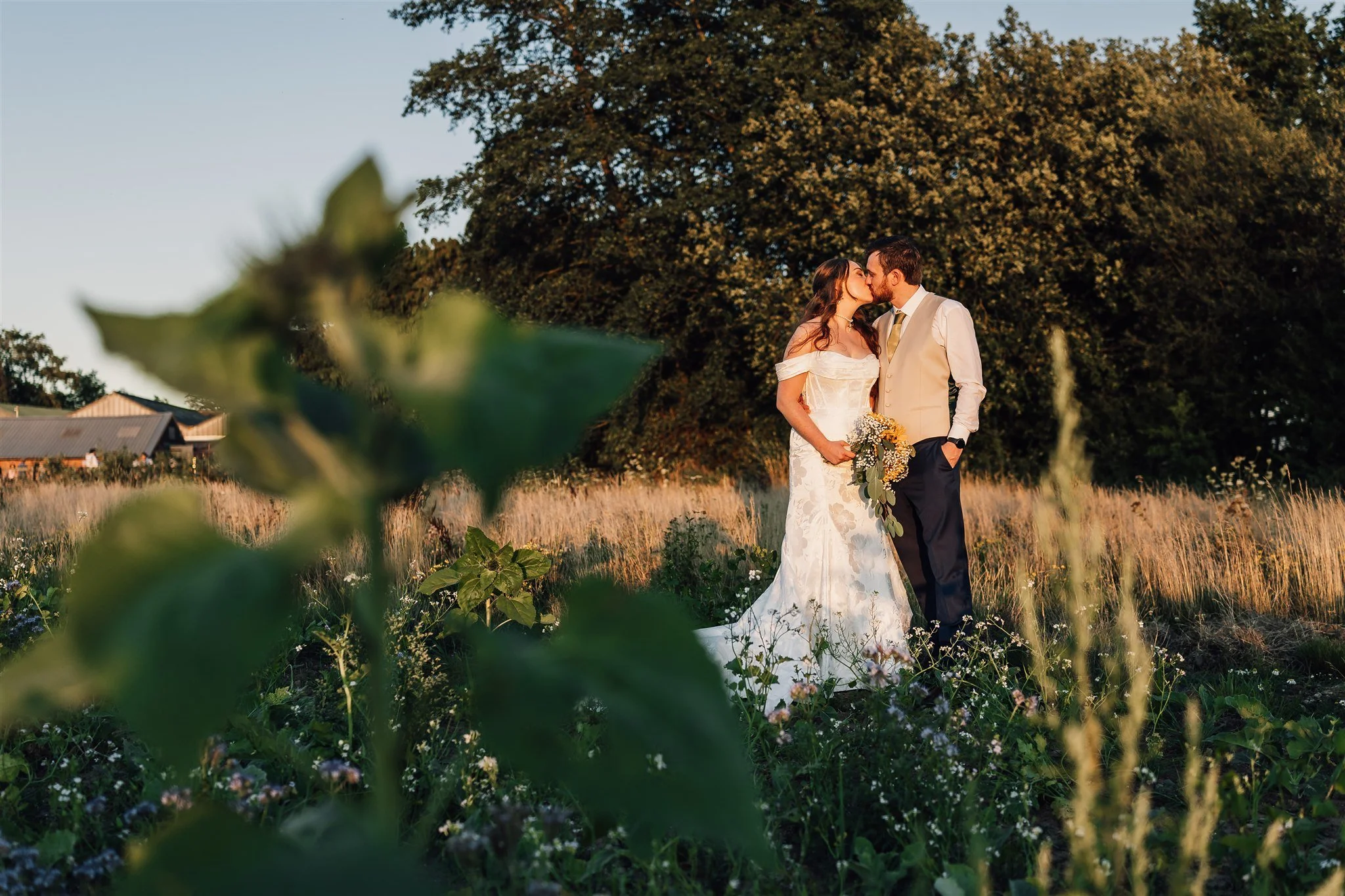 Bride and groom during sunset in a field at White Syke Fields