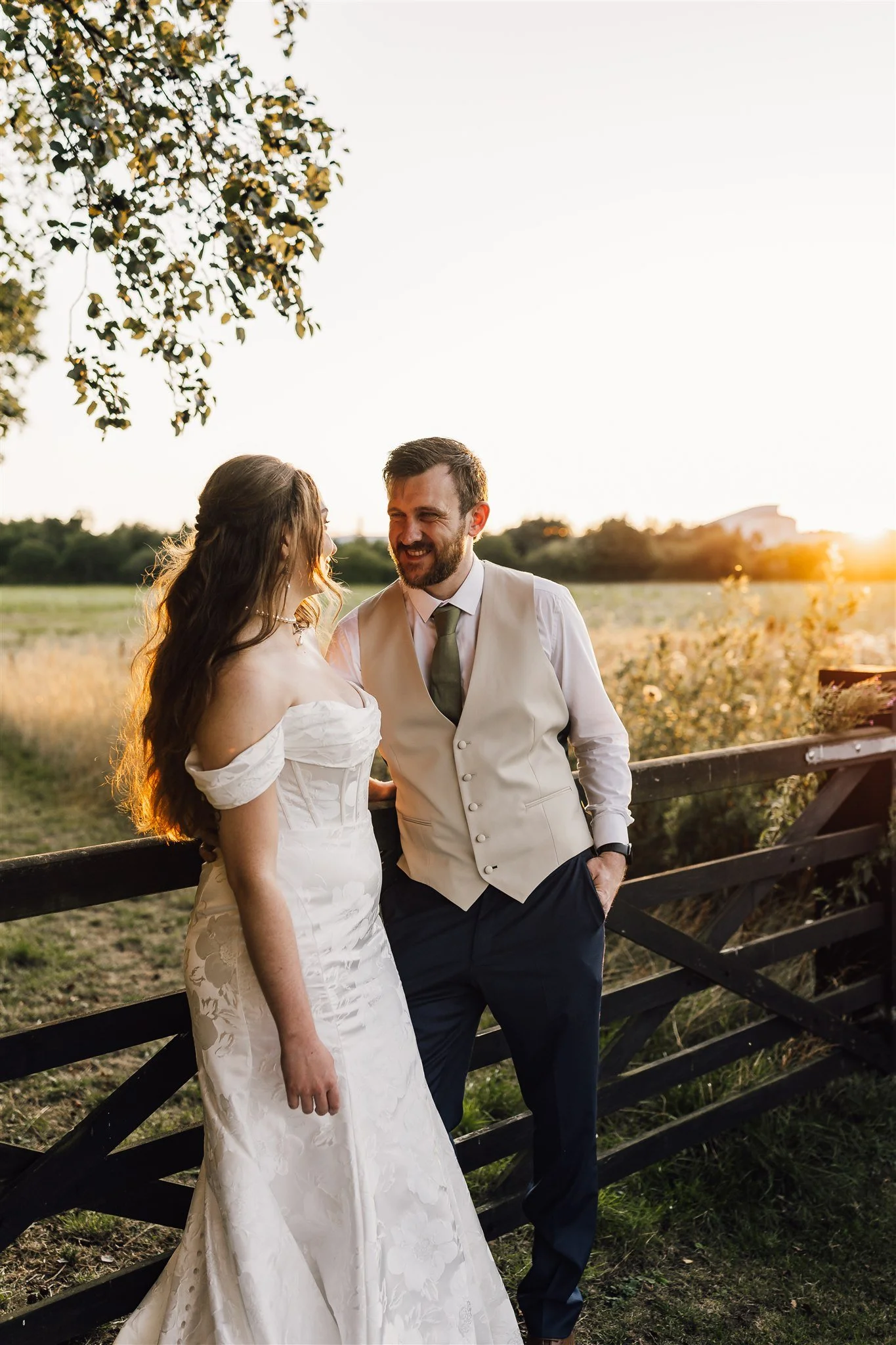 Bride and groom during sunset in a field at White Syke Fields