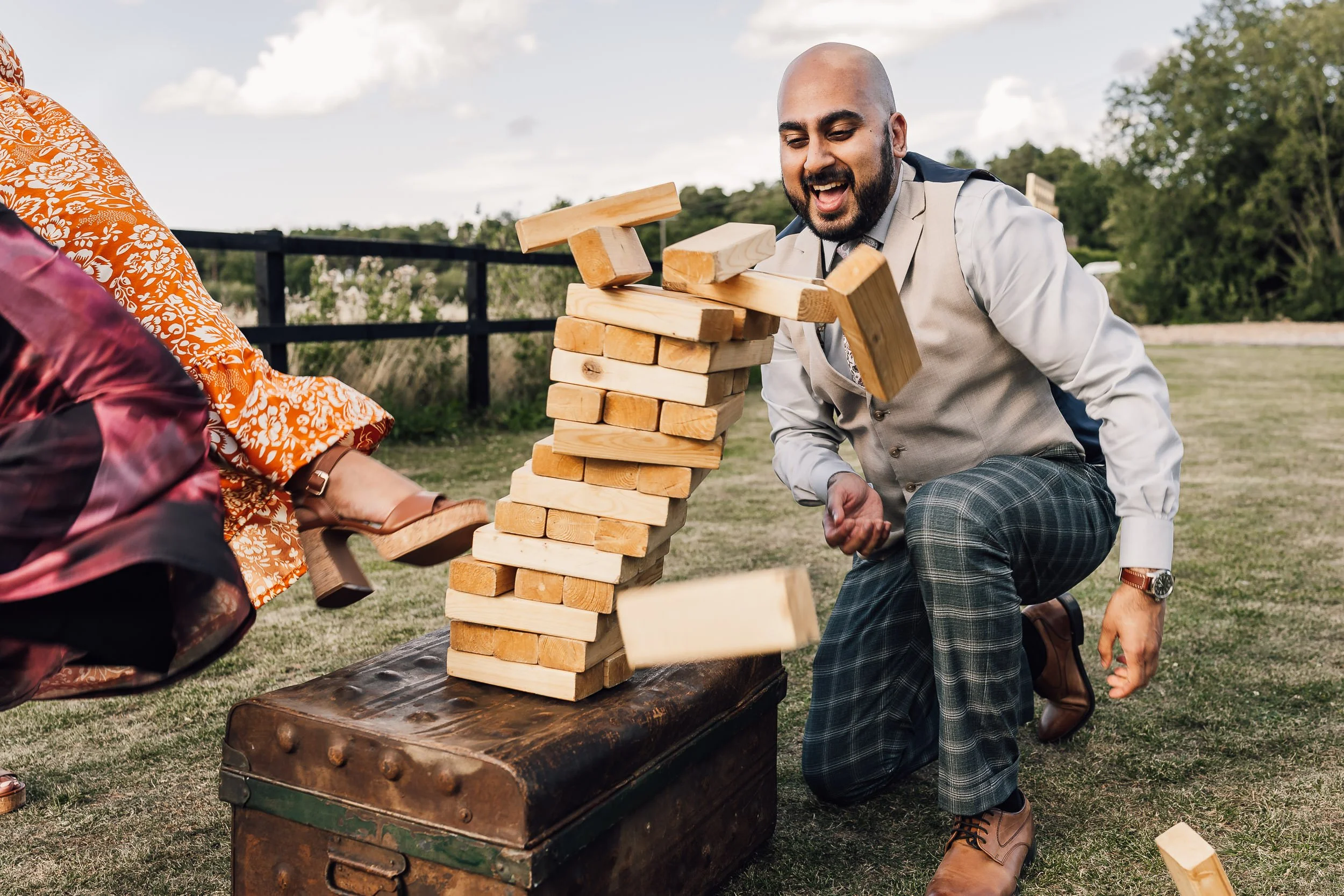 Wedding Guest Playing Giant Jenga Lawn Game
