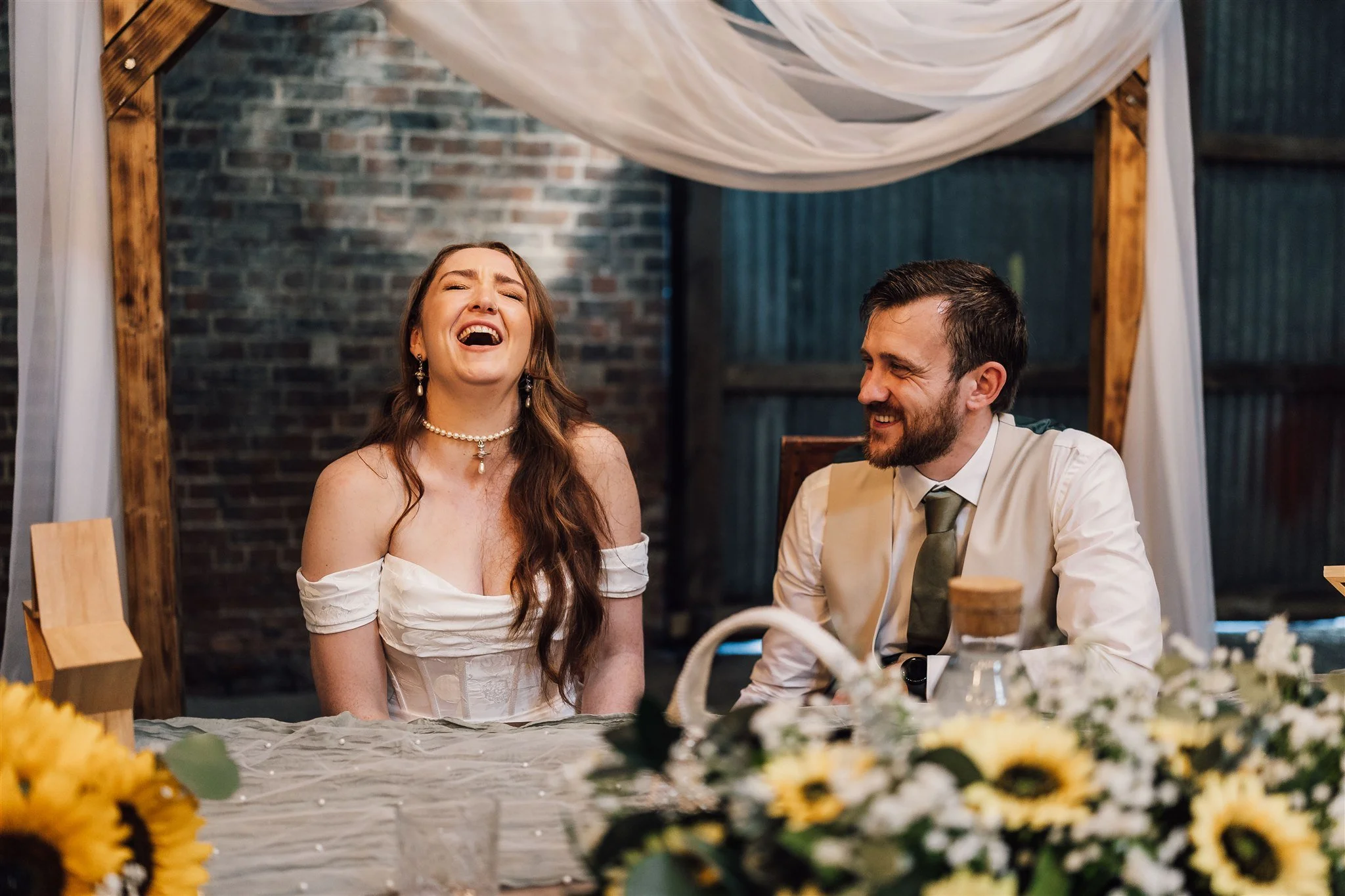 Bride laughing during speeches White Syke Fields