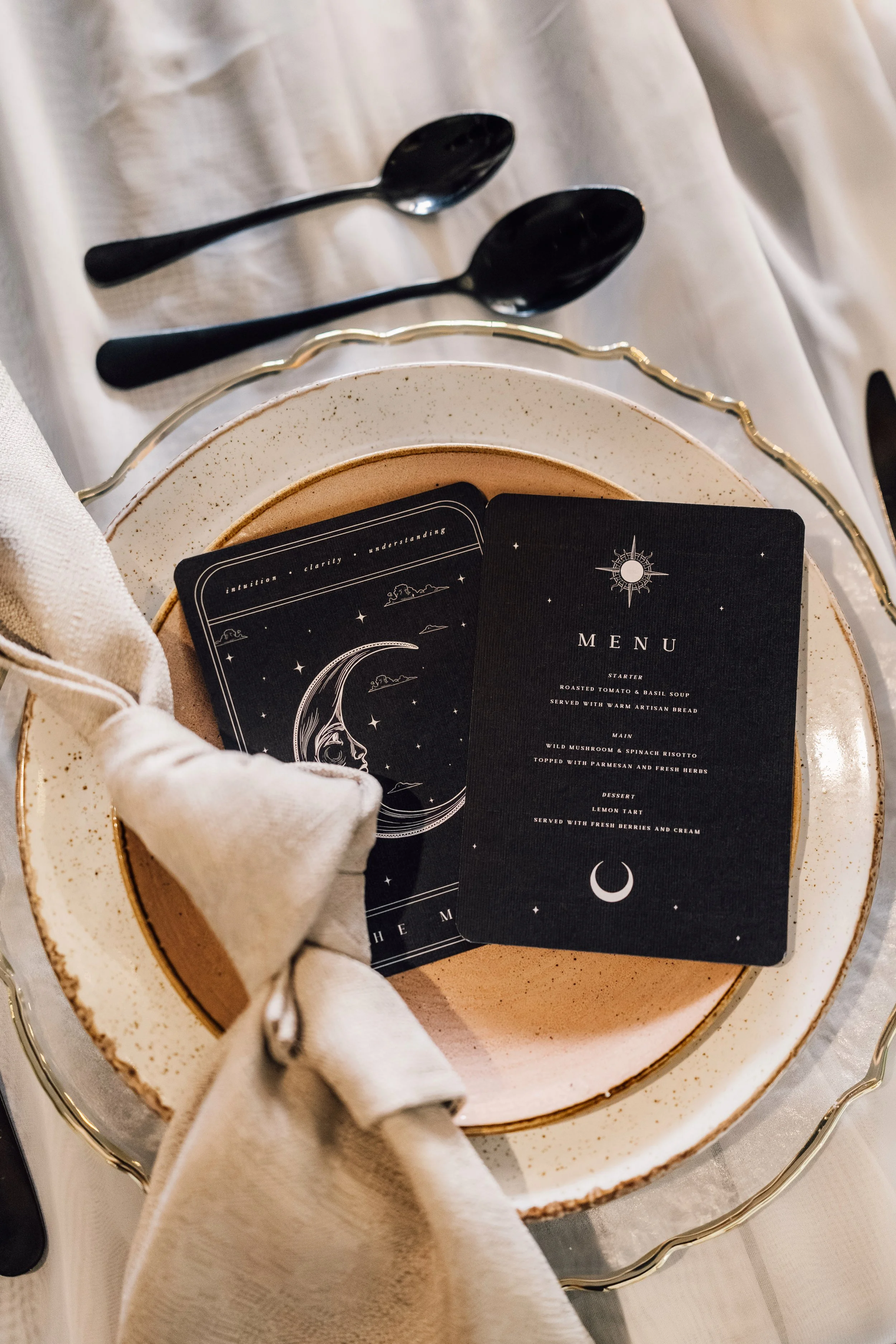 Celestial wedding table styling with moon menu and black stationery at Church Temple of Fun Sheffield