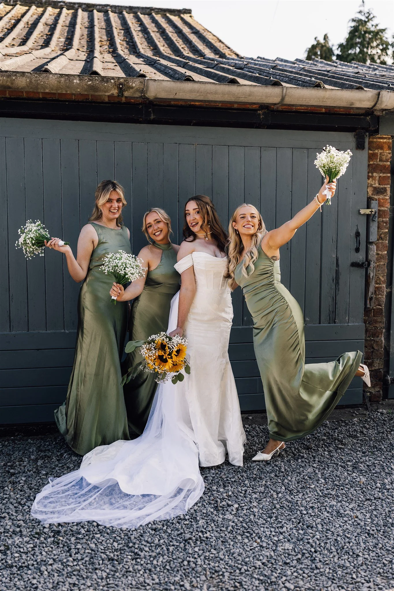 Bridesmaids Posing with Flowers