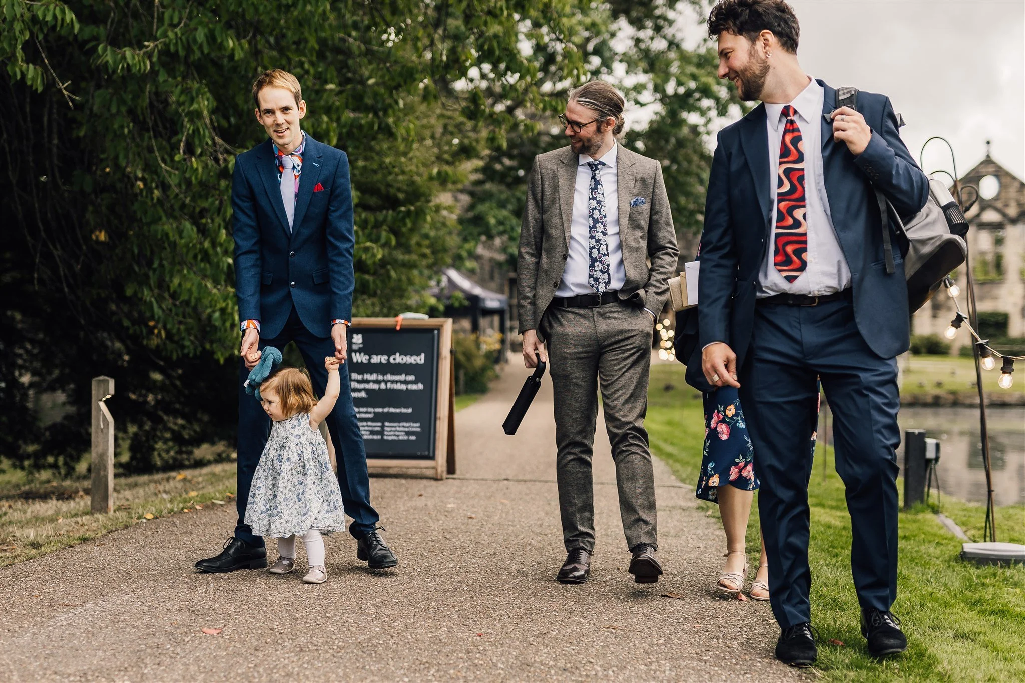 Documentary style wedding photography capturing guests arriving at East Riddlesden Hall