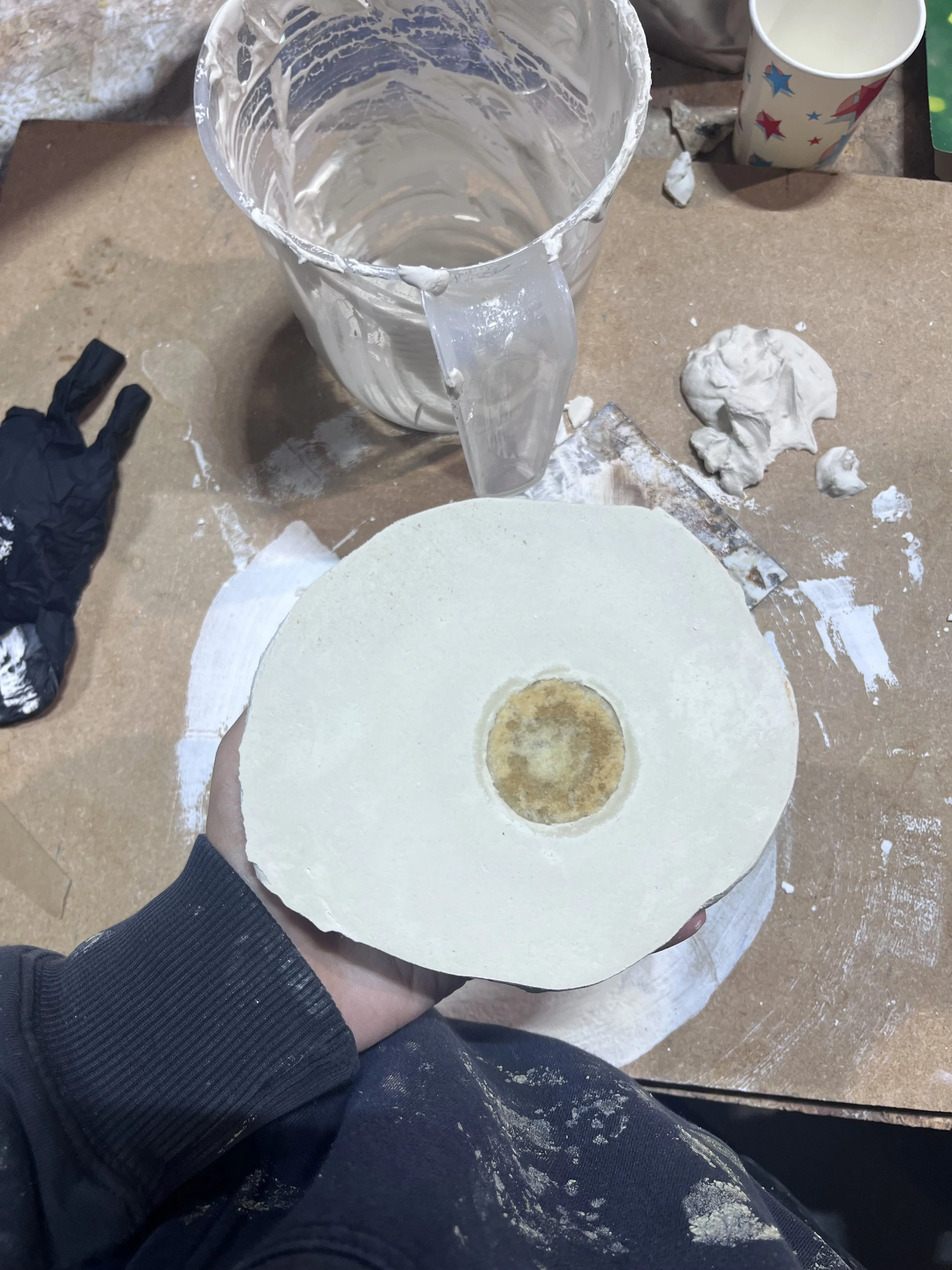 Plaster mould formed around a mince pie