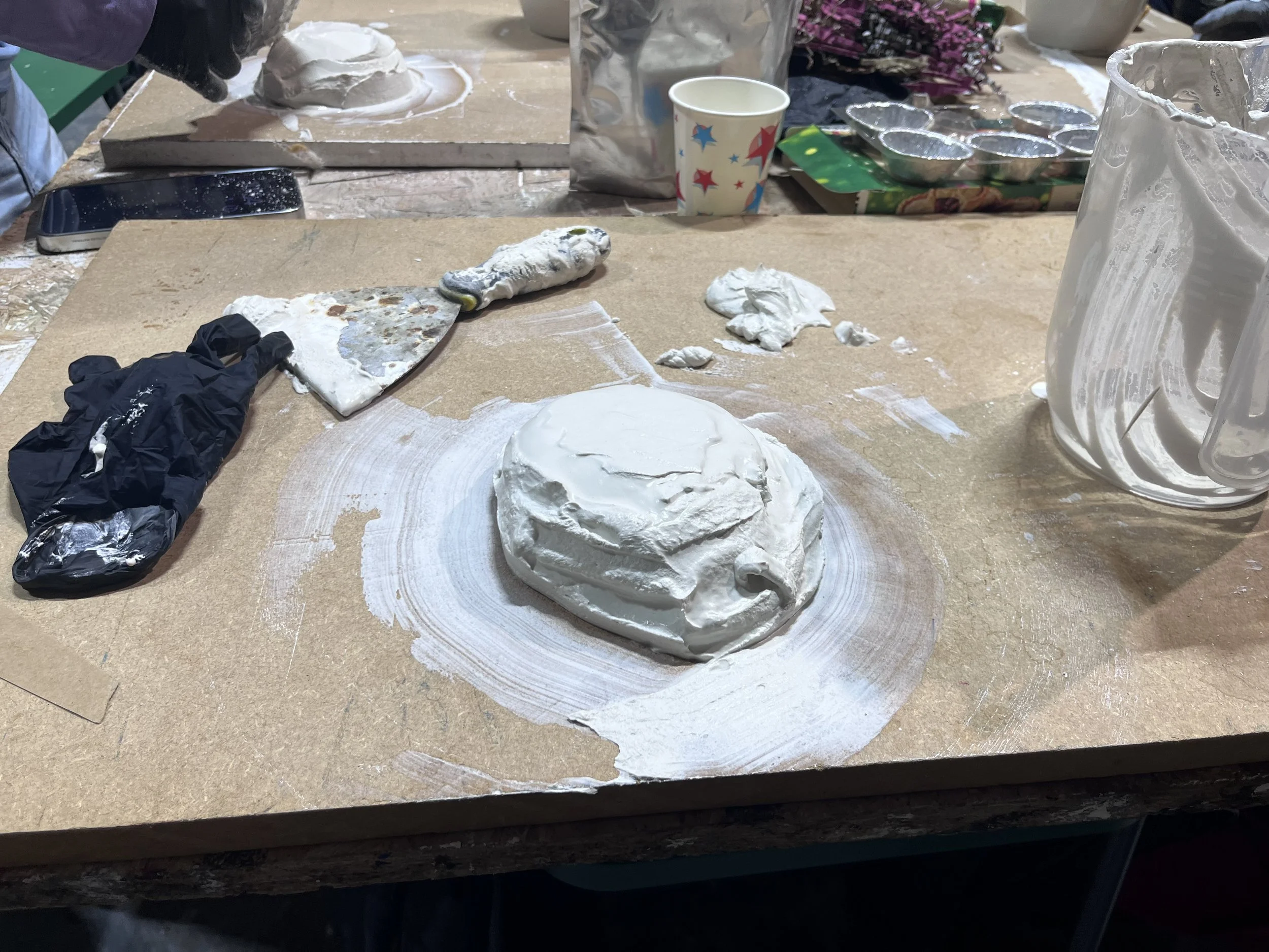 Plaster mould formed around a mince pie