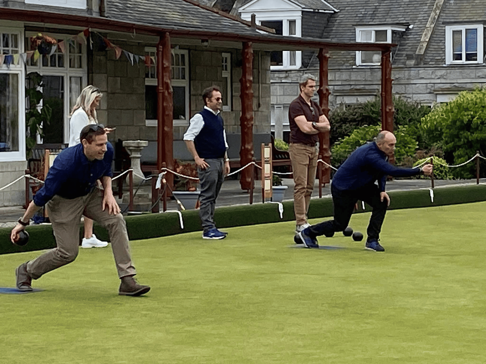 Two men lawn bowling