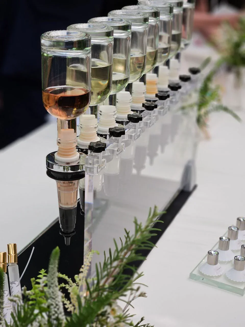 Perfume bar setup with fragrance dispensers at a luxury event