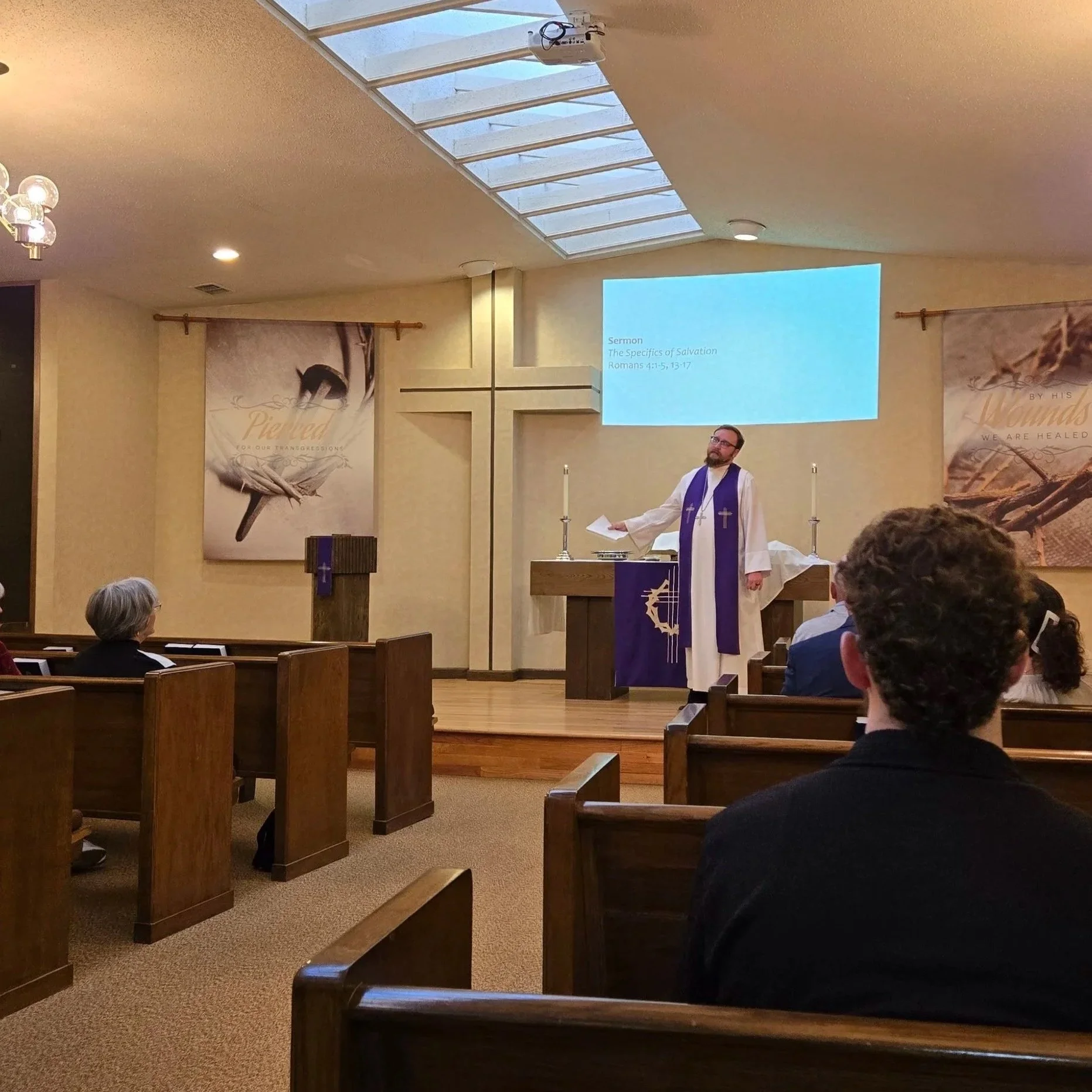 image of Pastor preaching in the front of church
