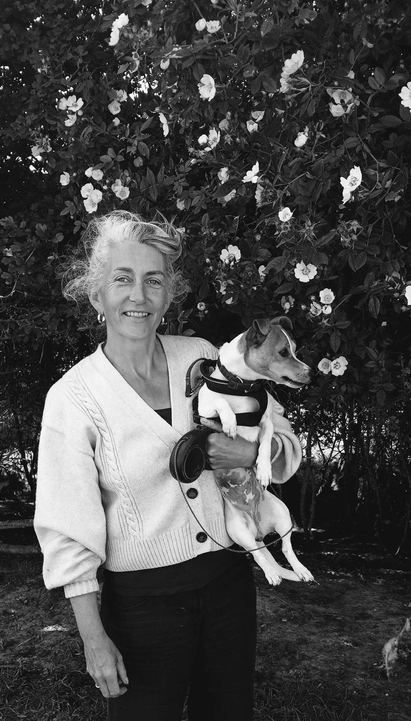 Lisa Dear Basket Maker and teacher black and white portrait with her dog.