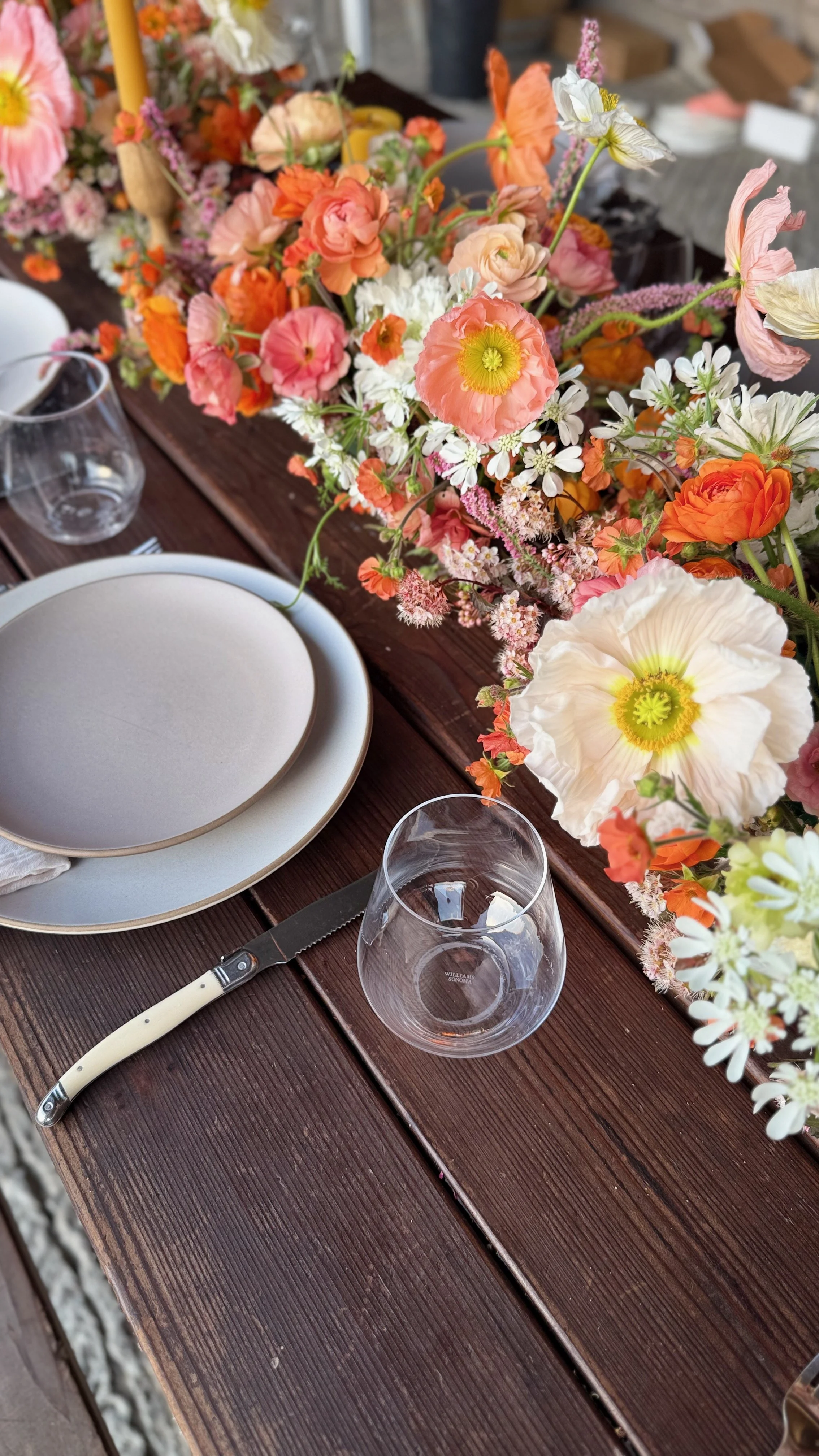 Farm table with local sustainably grown floral runner featuring Icelandic poppies