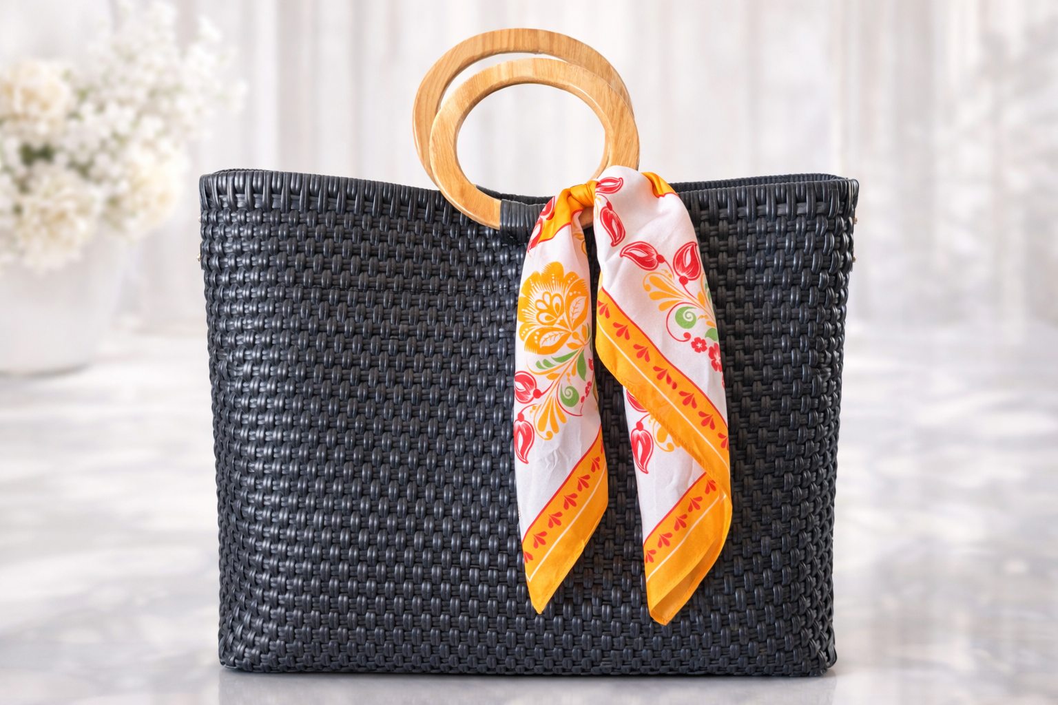 Woven BLACK handbag with ORANGE silk scarf.png