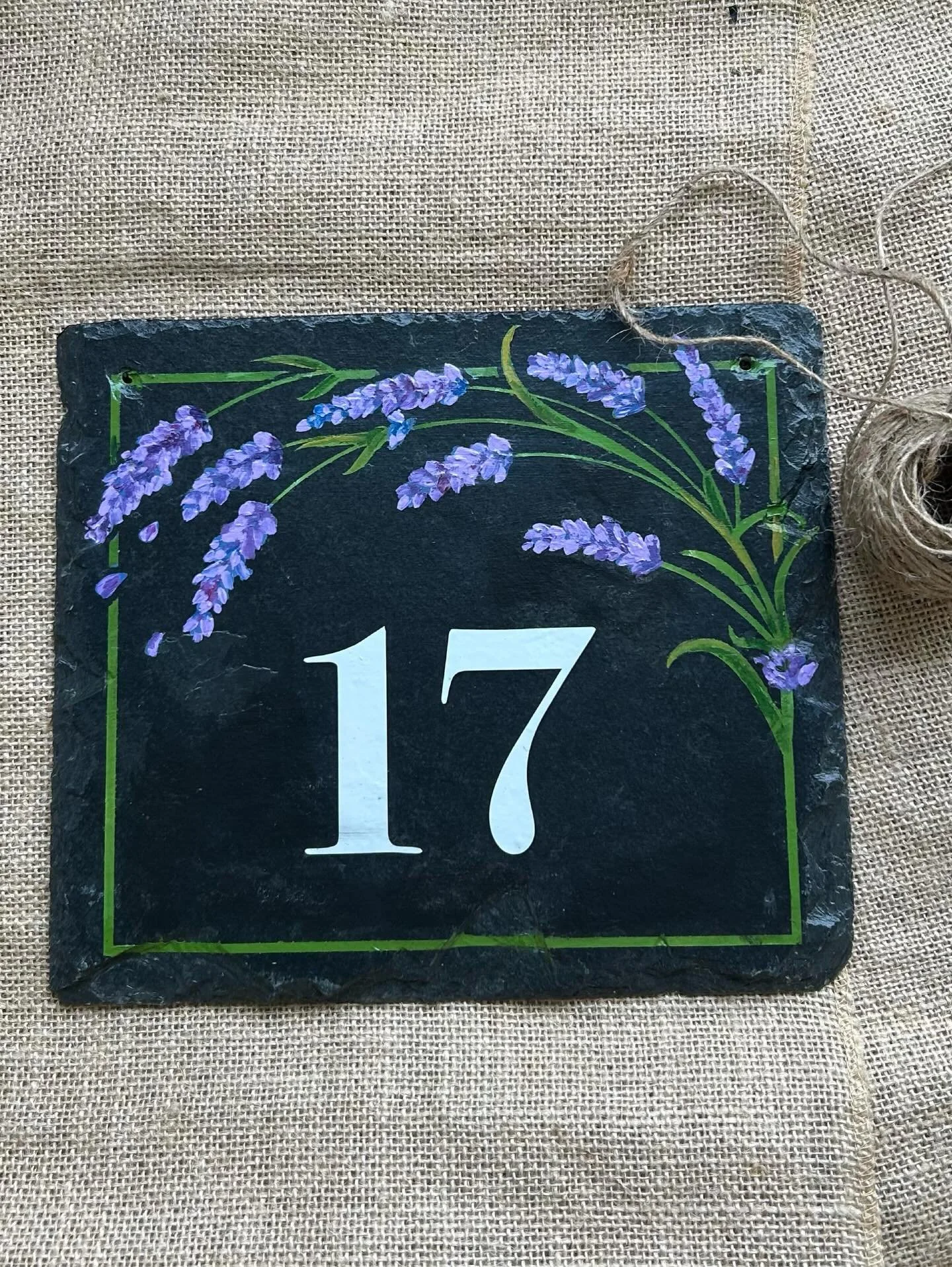 Hand-painted lavender on natural slate, finished with your house number. Check out link in my bio to see more designs
