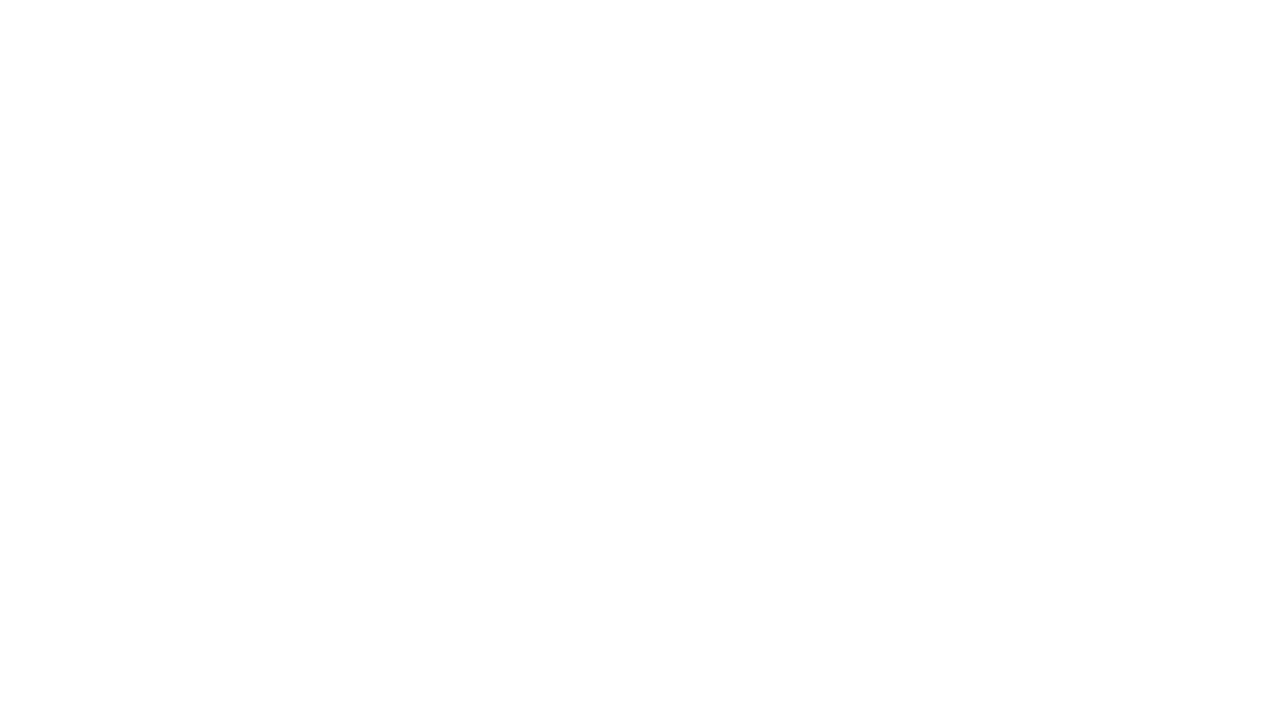 Silhouette of grass against a black background.