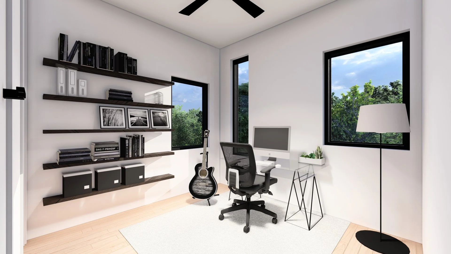Modern home office with white walls, black window frames, a black ceiling fan, and a white desk with a computer, chair, and plants. Black bookshelves hold books, binders, and framed photos. A black and white guitar is next to the desk, and a tall bla