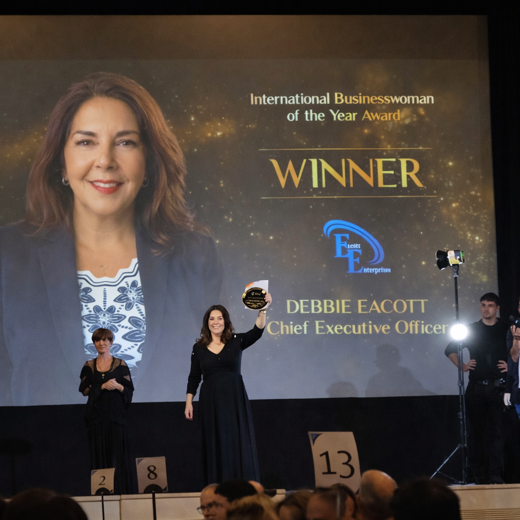 Laurie’s customers, Mariana and Carmen holding hands on a green lawn on their wedding day.