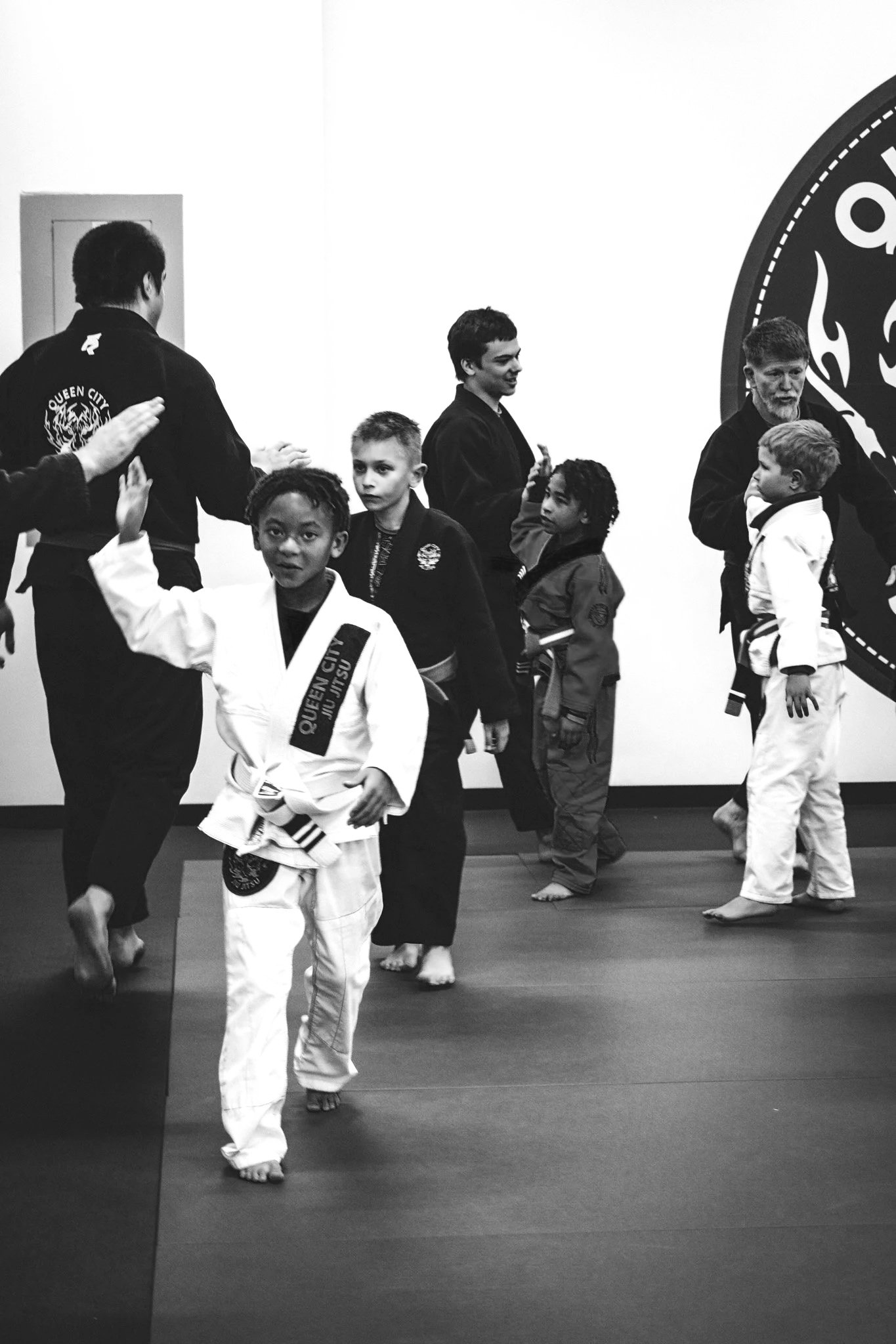 Youth jiu jitsu class in Fort Mill — kids drilling techniques at QCJJ