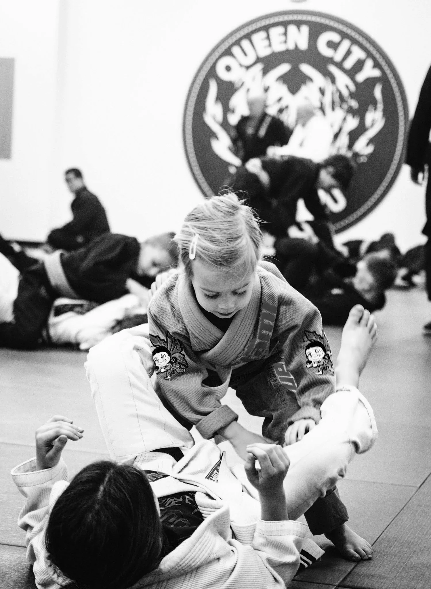 Young children practicing jiu jitsu techniques in class at QCJJ Fort Mill