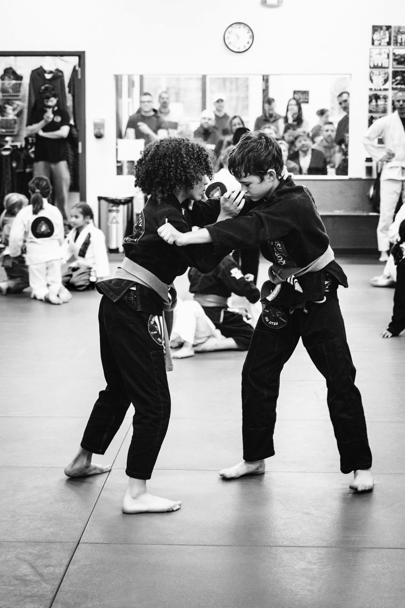Kids jiu jitsu class in Fort Mill, SC — students drilling takedowns on the mat