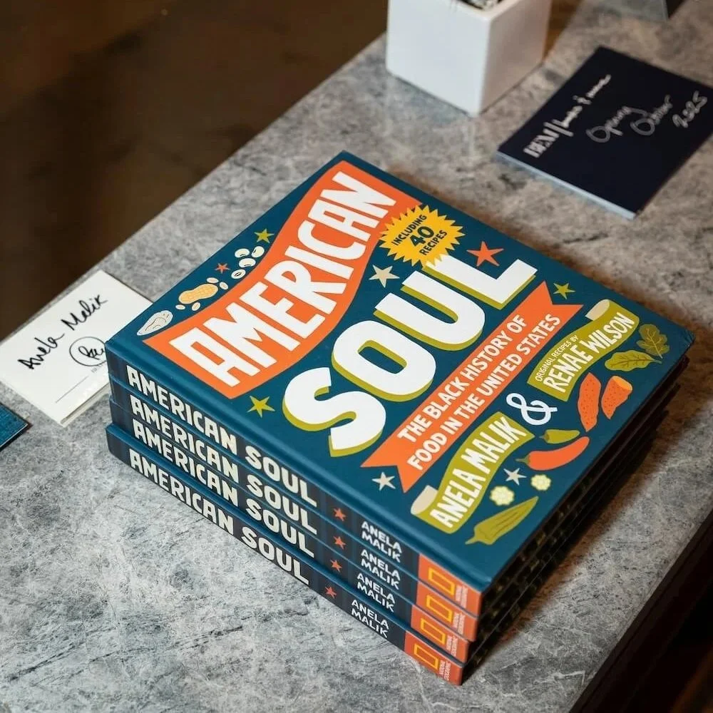 Stack of four books titled 'American Soul' by Anela Malik on a marble countertop.