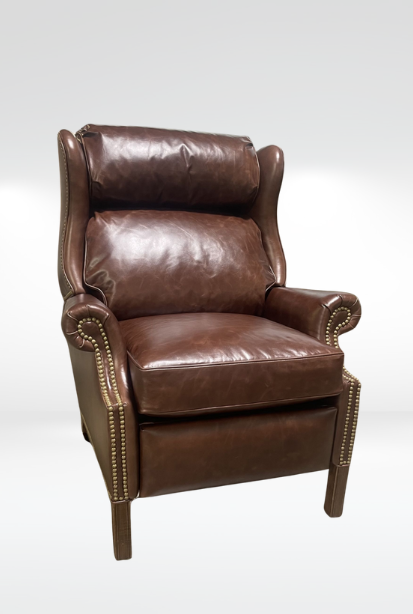 Newman Chair || Brown leather armchair with nailhead trim on white background.