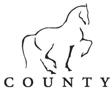 Line drawing of a horse with the word 'COUNTY' underneath.