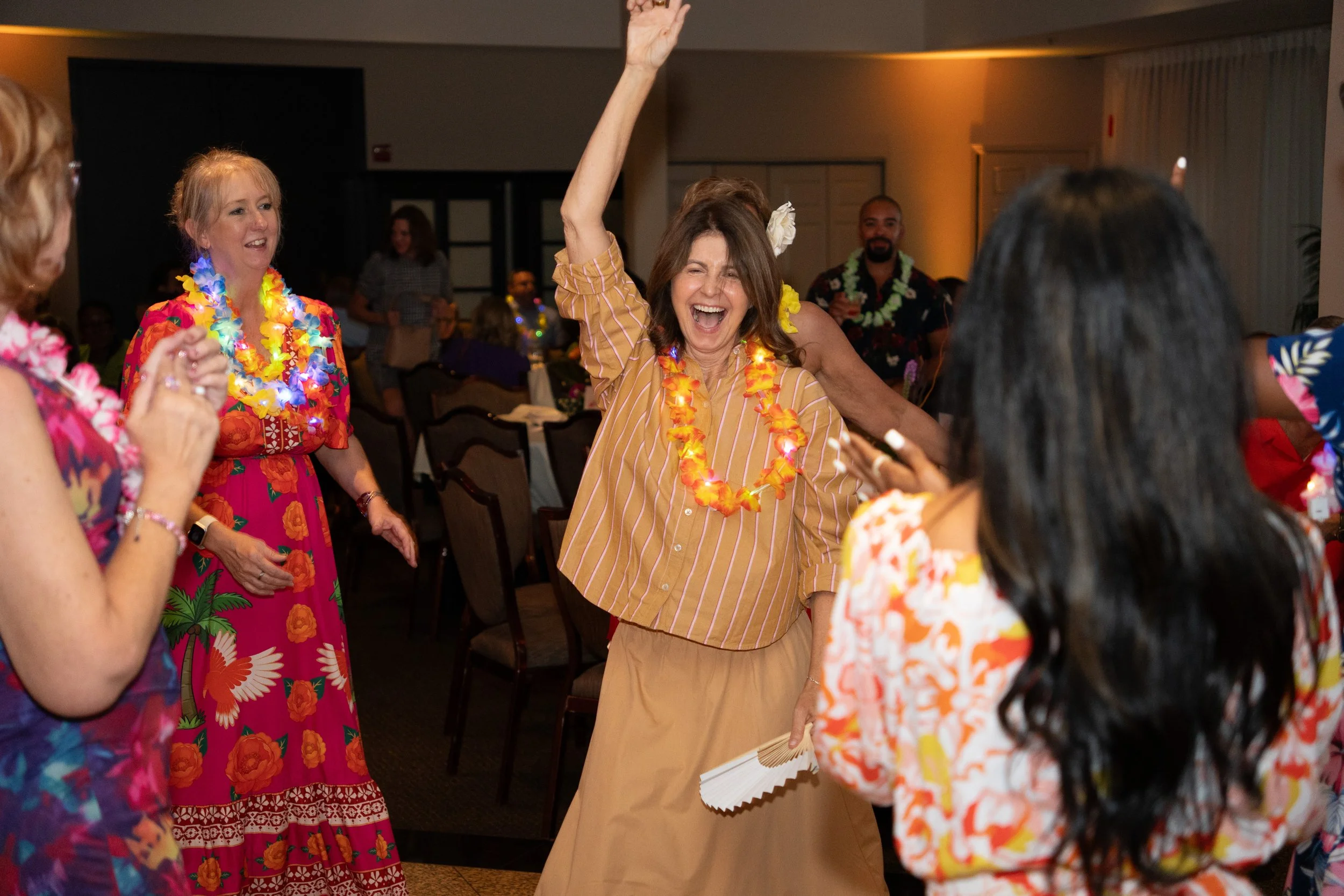 women dancing at tropical themed event
