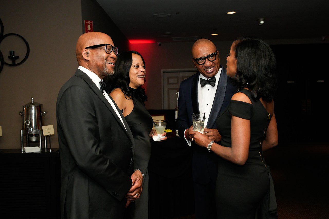 group of four conversating during cocktail hour