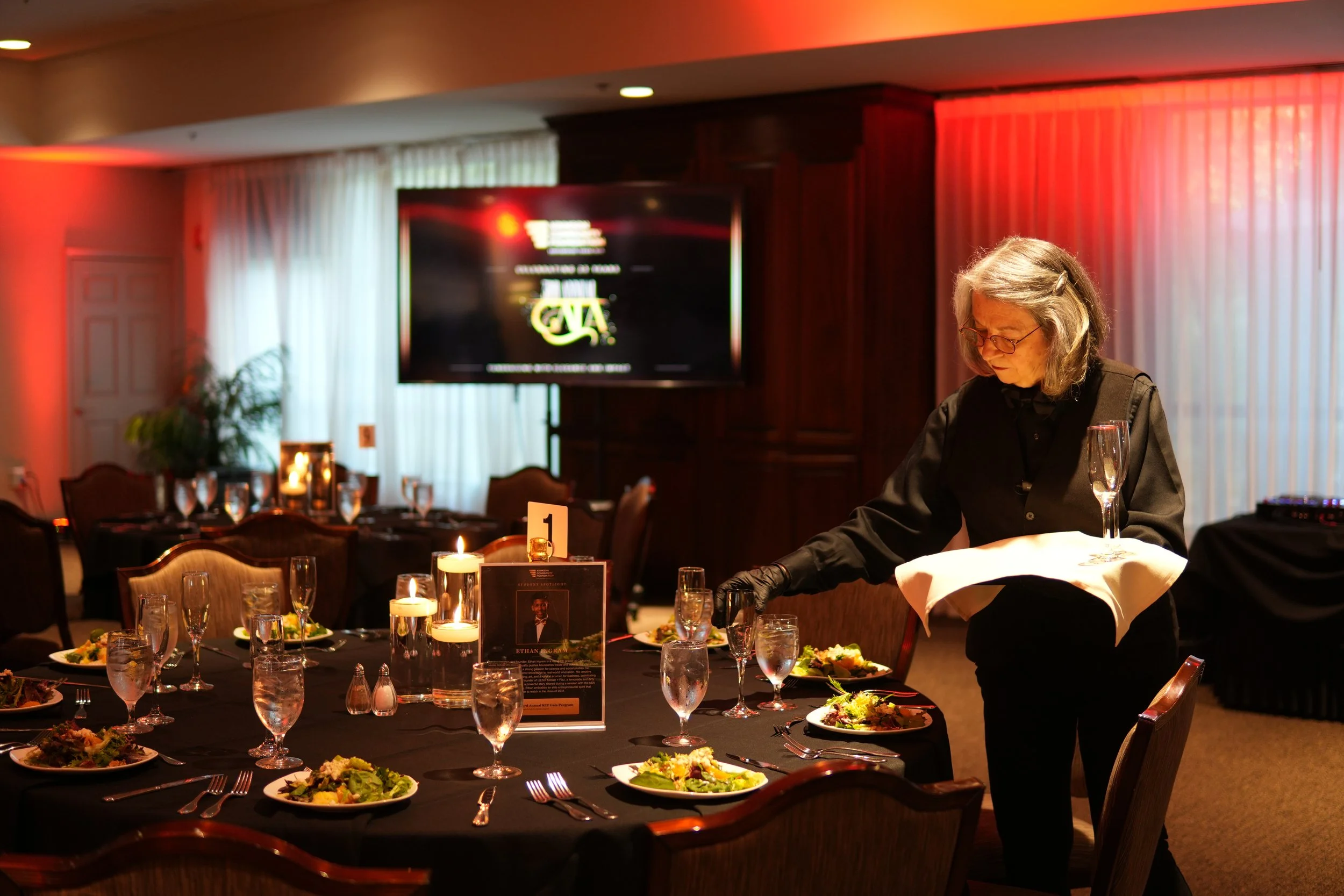staff member setting tables