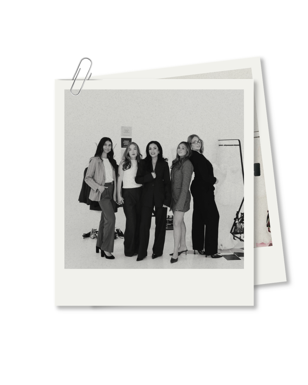 Black and white photo of five women dressed in formal attire, standing together in an indoor setting. Forever After, Instantly - Wedding Content Creator Team in TX and Oklahoma.