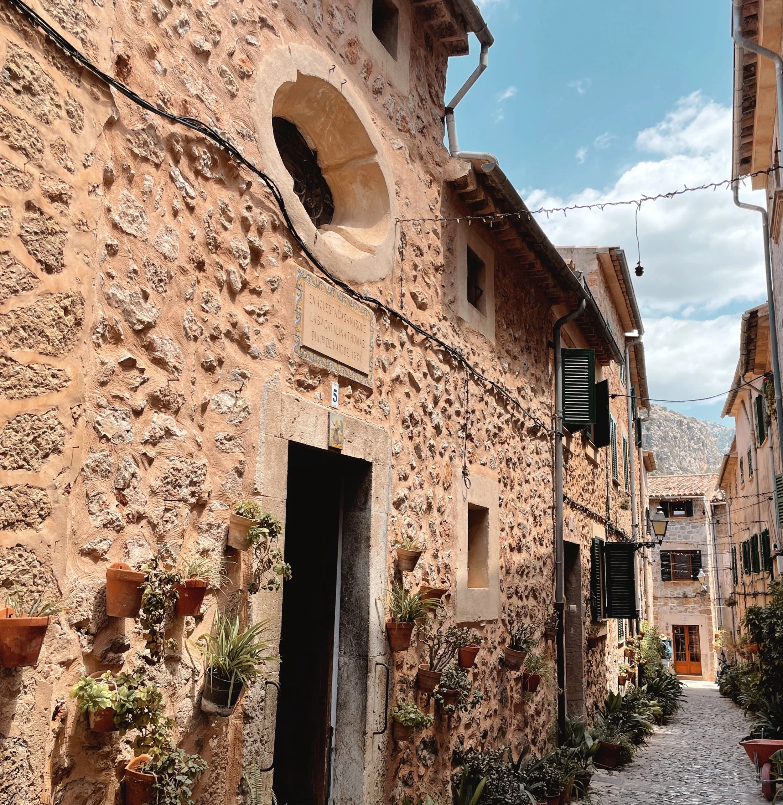 Looking along the cobbled lane of the tiny chapel of Santa Catalina Thomás, Valldemossa
