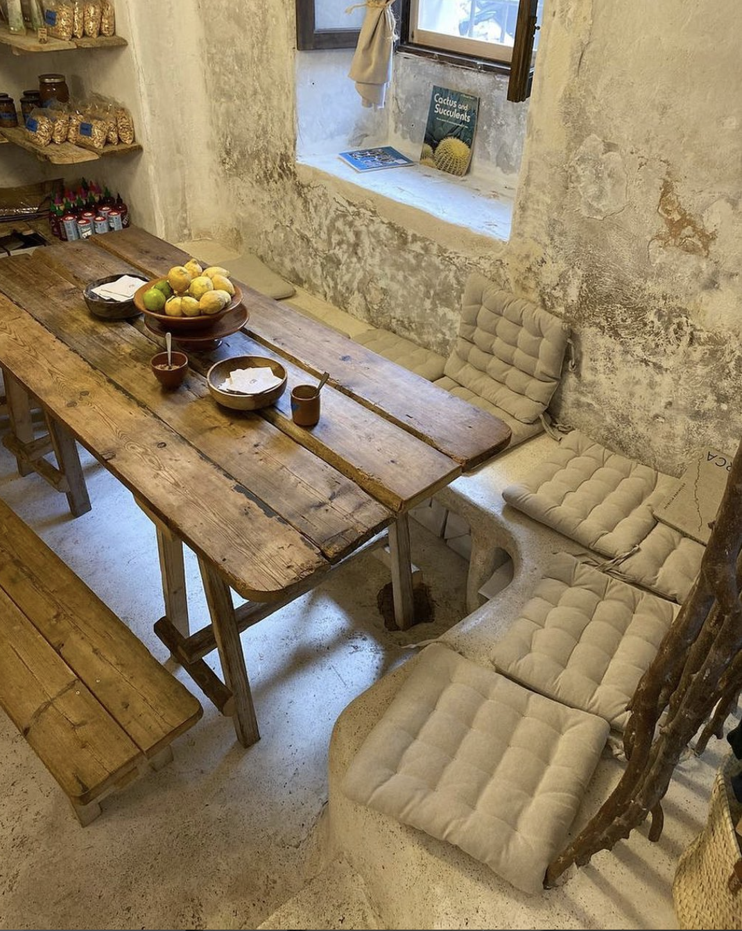 The rustic stone interiors of De Moniö cafe and store in Deià, Mallorca