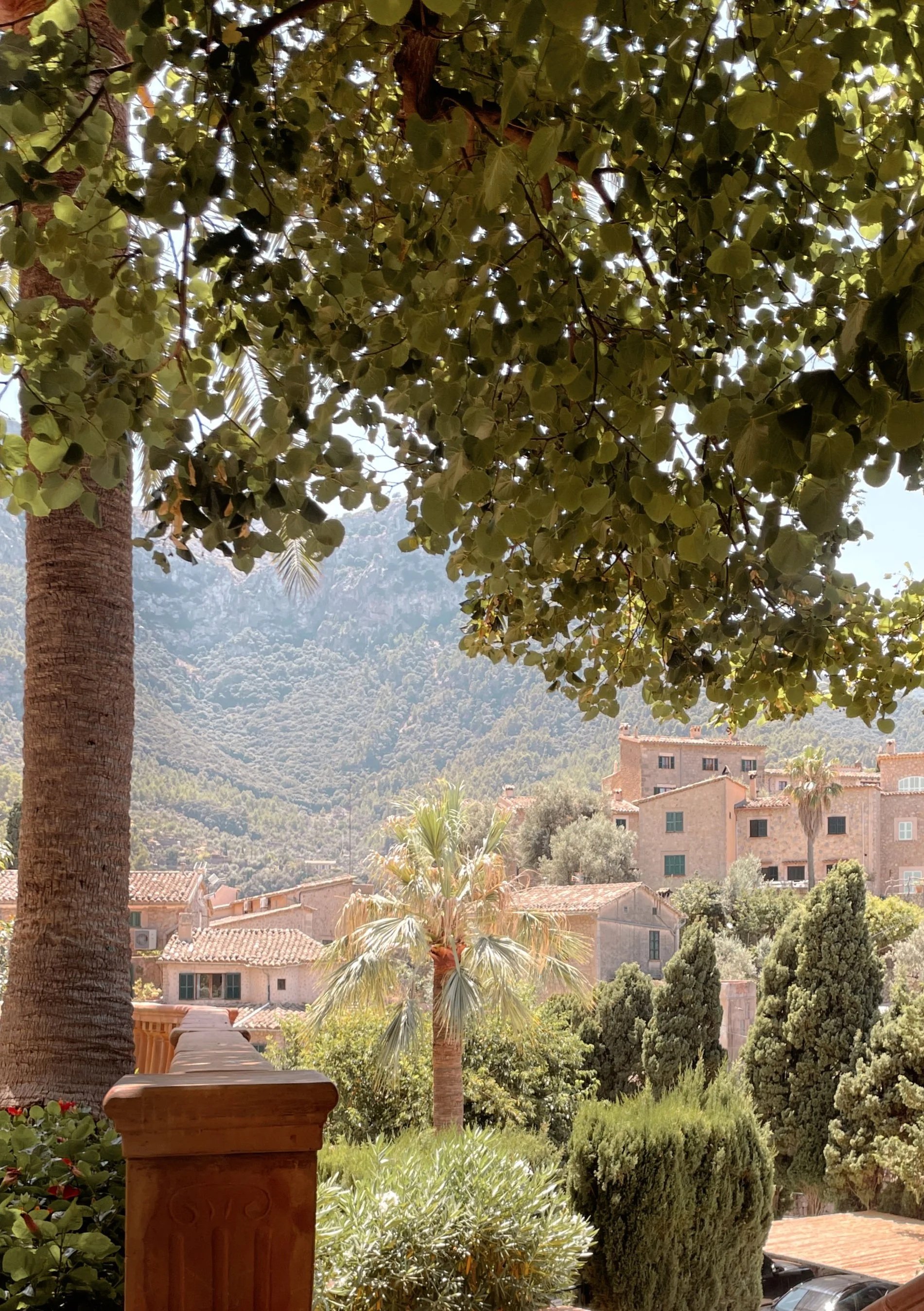 The view of the honey-coloured mountain village of Deià, in Mallorca from the terrace of Restaurante Miró at La Residencia